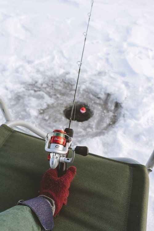Signpost overlooking a windswept Irish shoreline with waves breaking in the distance.